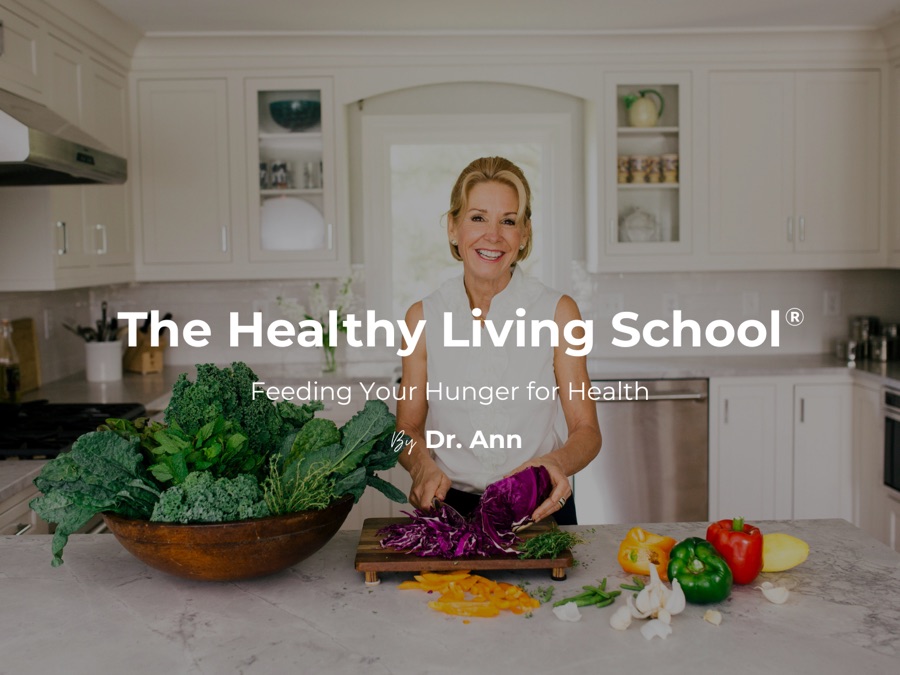 Dr. Ann preparing vegetables in a bright kitchen for The Healthy Living School